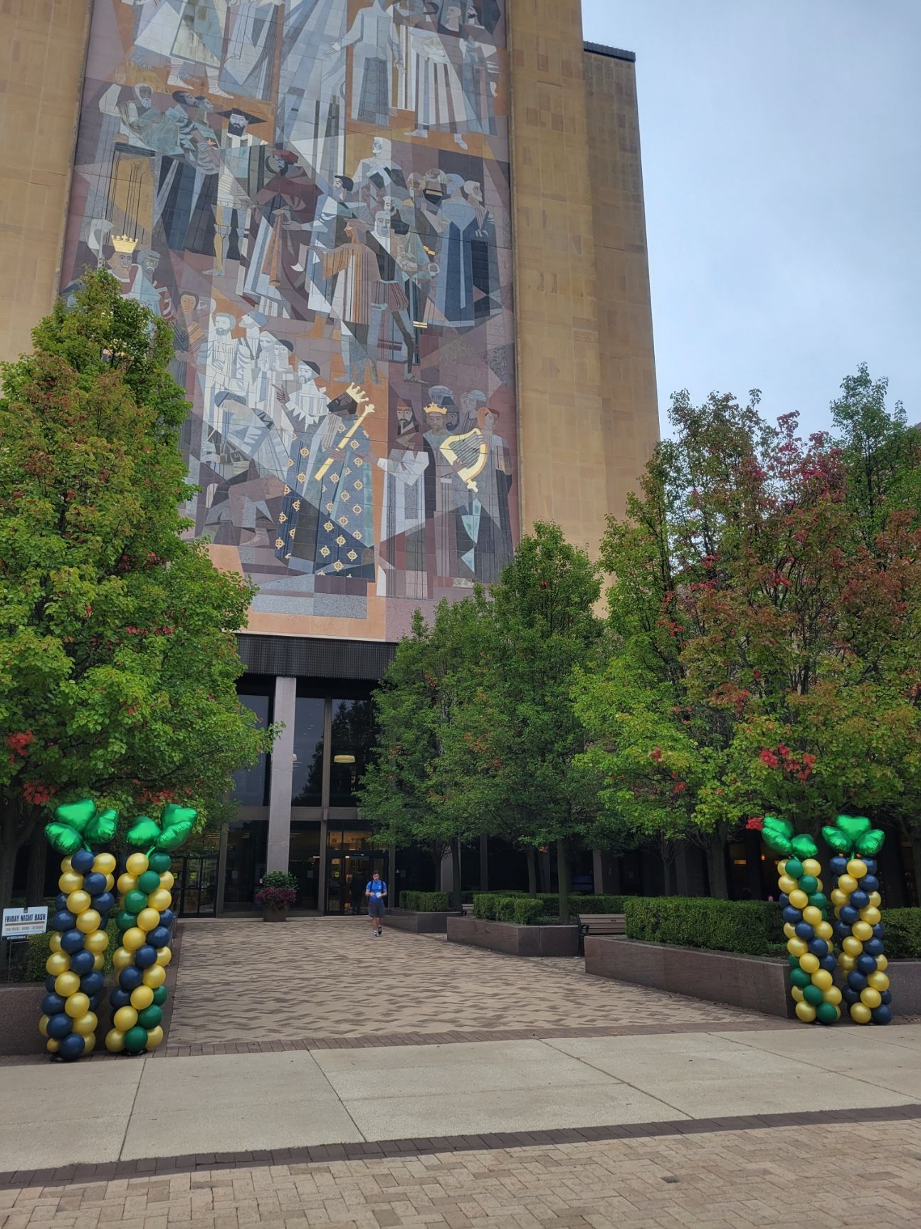 A large building with balloons in front of it