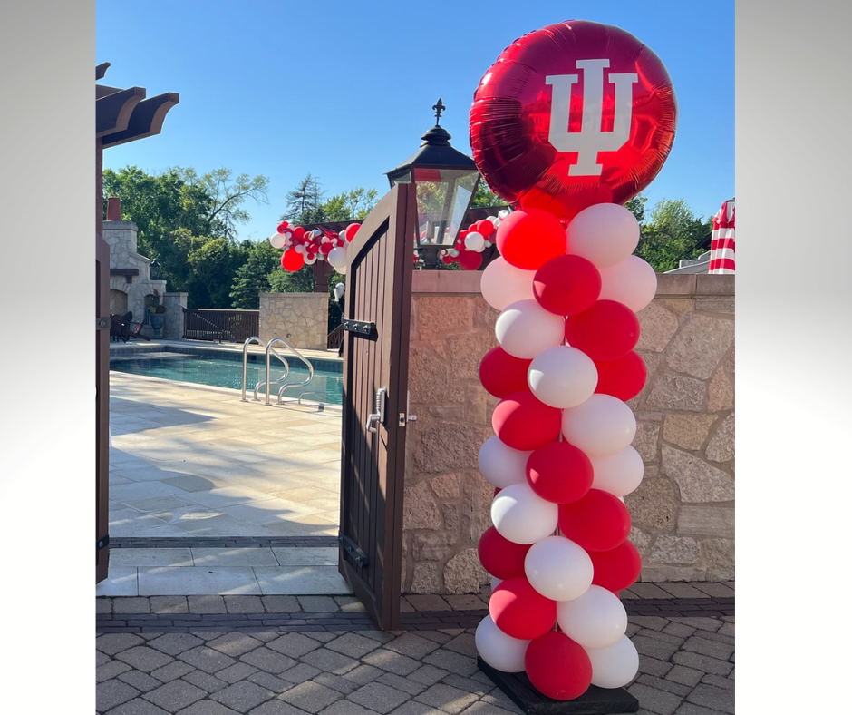 A red and white balloon column for the University of Indiana