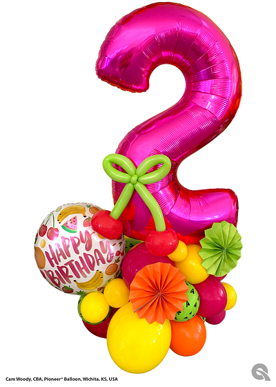 Pink number two balloon birthday centerpiece with other colorful balloons and decorations.