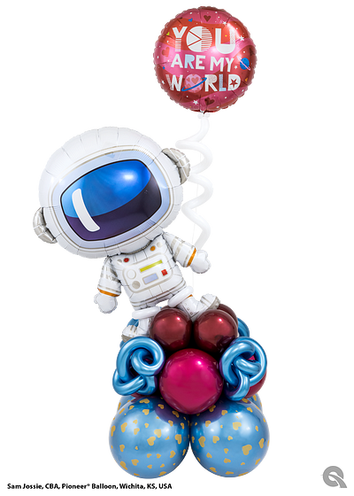 Astronaut balloon atop a cluster of balloons, with a