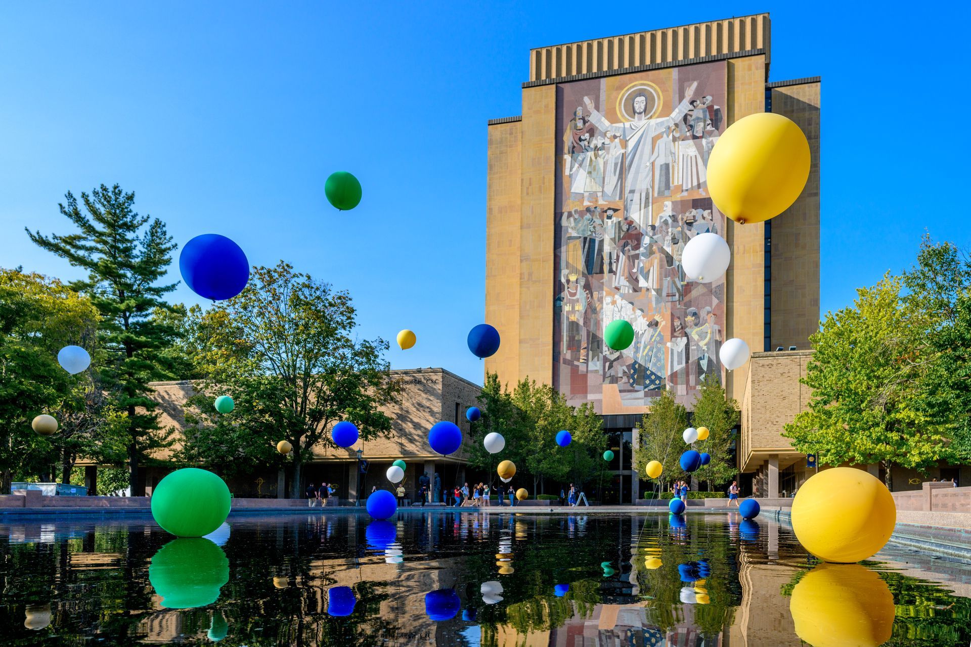 Reflecting pool at Notre dame with helium balloons from fun by the yard