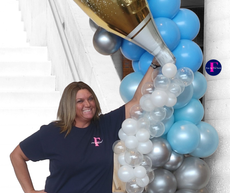 A woman wearing a shirt with the letter f on it