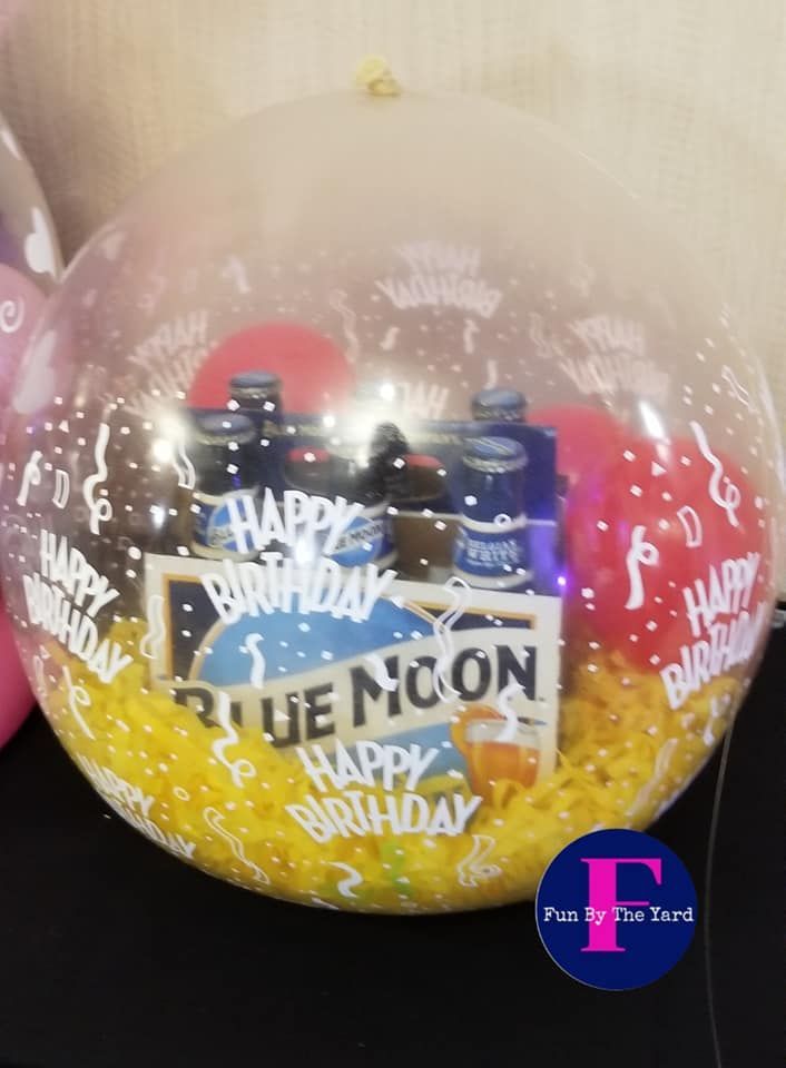 A clear balloon with the words happy birthday on it