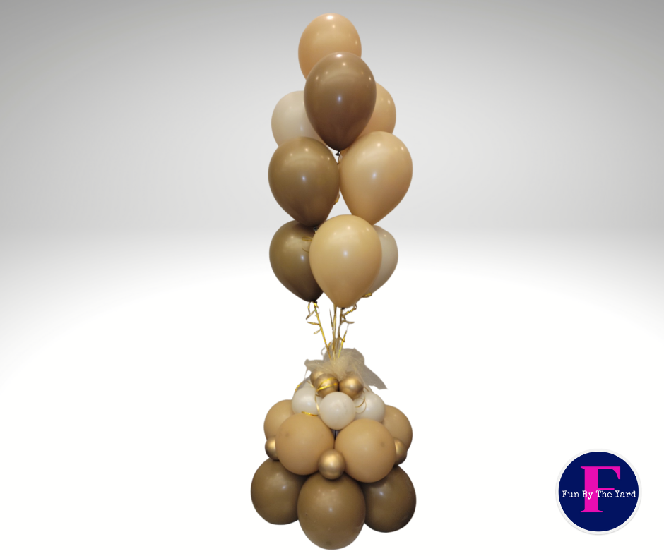 A bunch of brown and white balloons stacked on top of each other