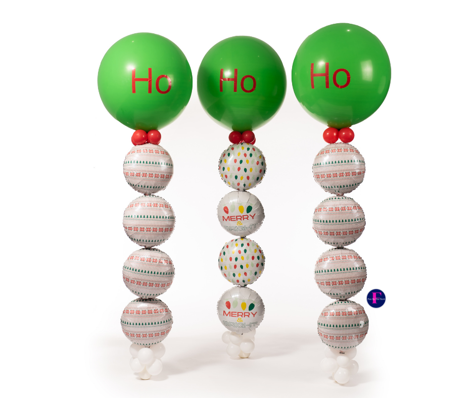 Three green balloons with the word ho on them