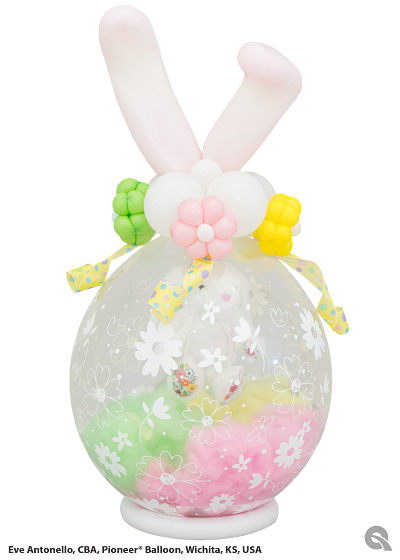 A balloon with bunny ears and flowers on it
