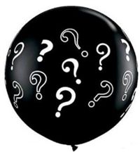 A black balloon with white question marks on it.