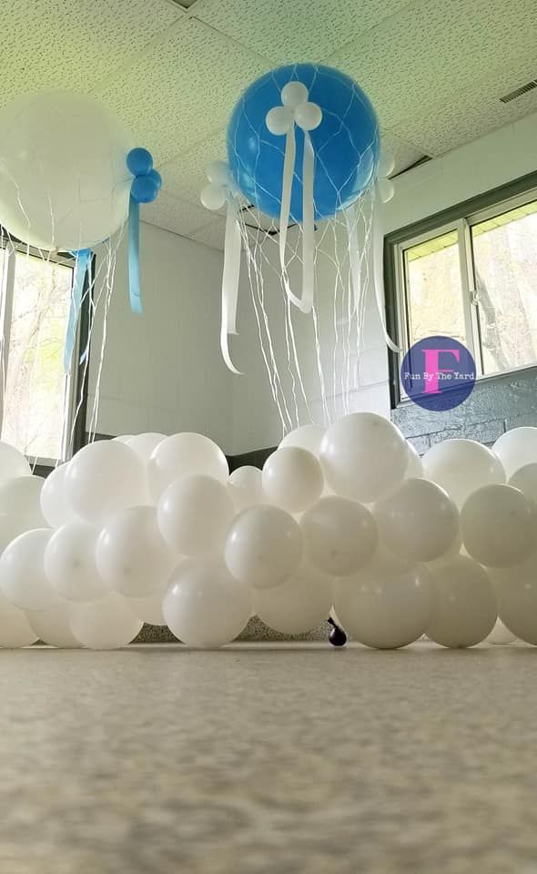 hot air balloons over clouds made of latex balloons