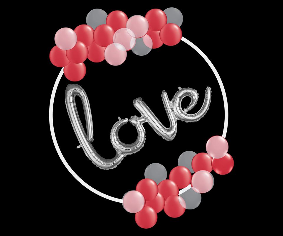 A balloon with the word love written on it is surrounded by red and gray balloons.