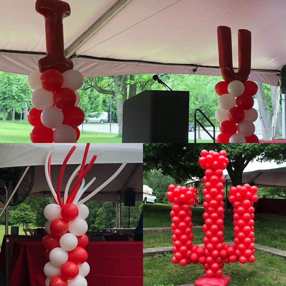 Red and white balloons in the shape of and IU