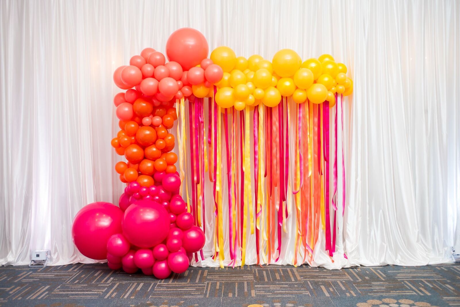 balloon garland demi arch in pink orange and yellow