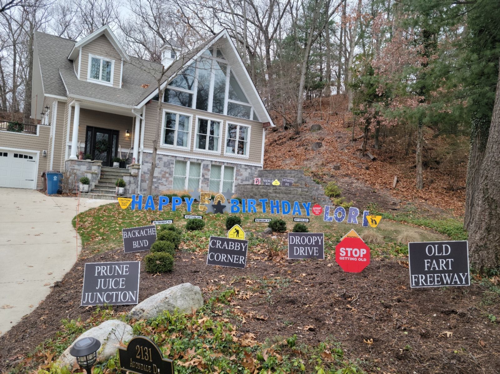 A house with a lot of signs in front of it.