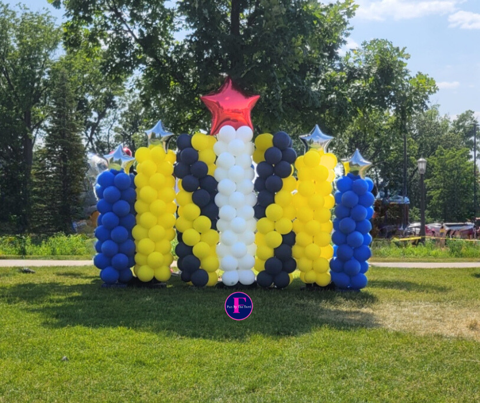 A balloon column backdrop with star toppers for graduation in South Bend