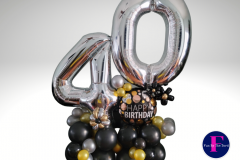 A bunch of balloons with the number 40 on them