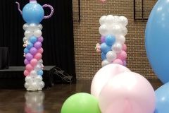 A room filled with balloons and a teapot made out of balloons.