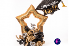 A congratulations graduation balloon in the shape of a star.
