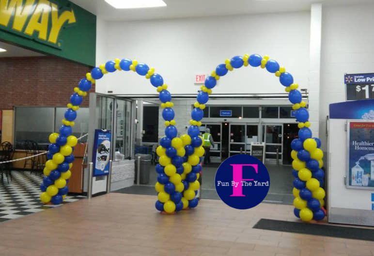 Blue and yellow balloons in front of a subway store at Walmart