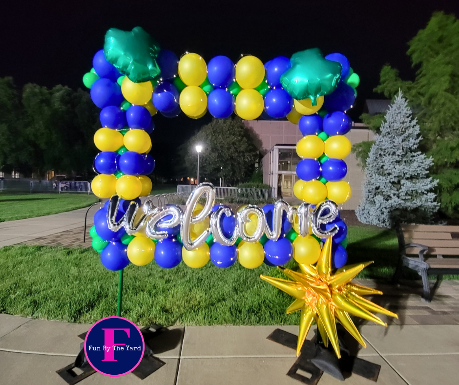 a welcome sign made of blue and yellow balloons