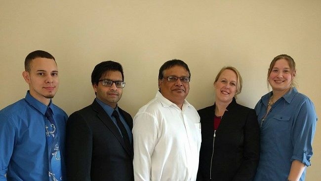Medical practice staff in front of an urgent care clinic