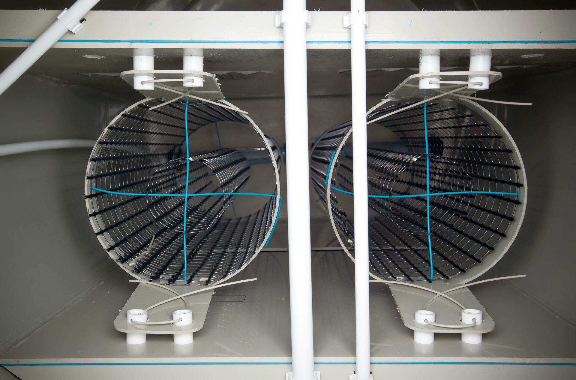 A close up of a fan with a blue cross on it