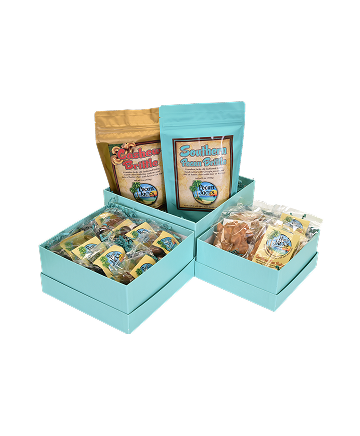 Gift box set with turquoise boxes, featuring snack bags and individually wrapped treats.