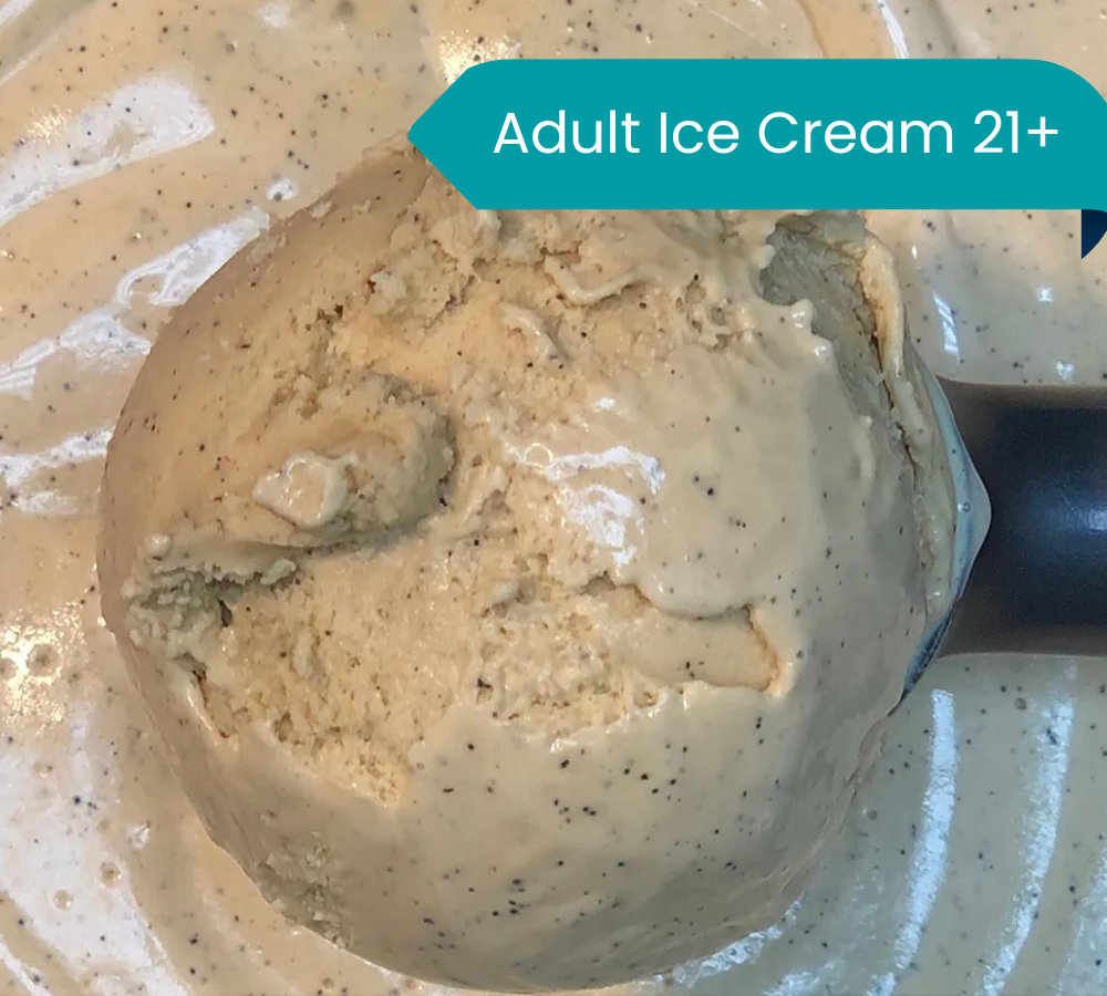 A close up of a scoop of ice cream on a plate