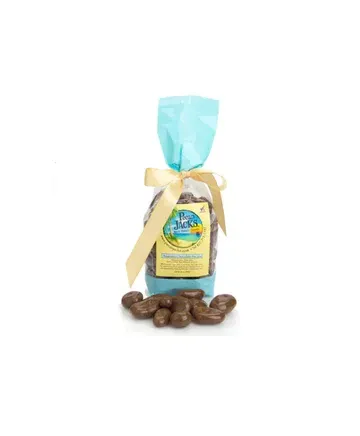 A bag of chocolate covered almonds with a bow on a white background.