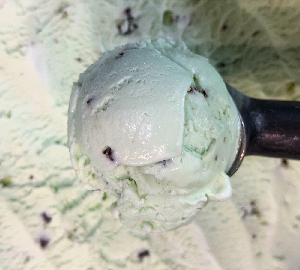 A close up of a scoop of ice cream on a table