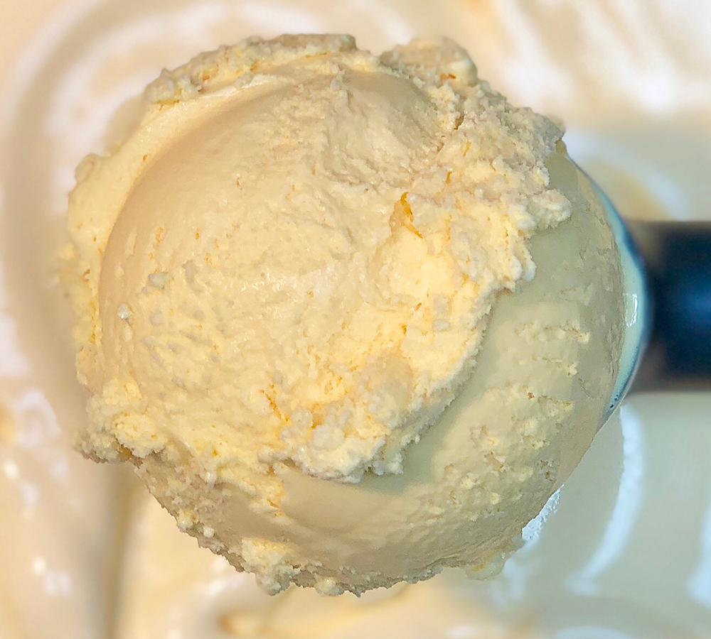 A scoop of chocolate ice cream with marshmallows on top