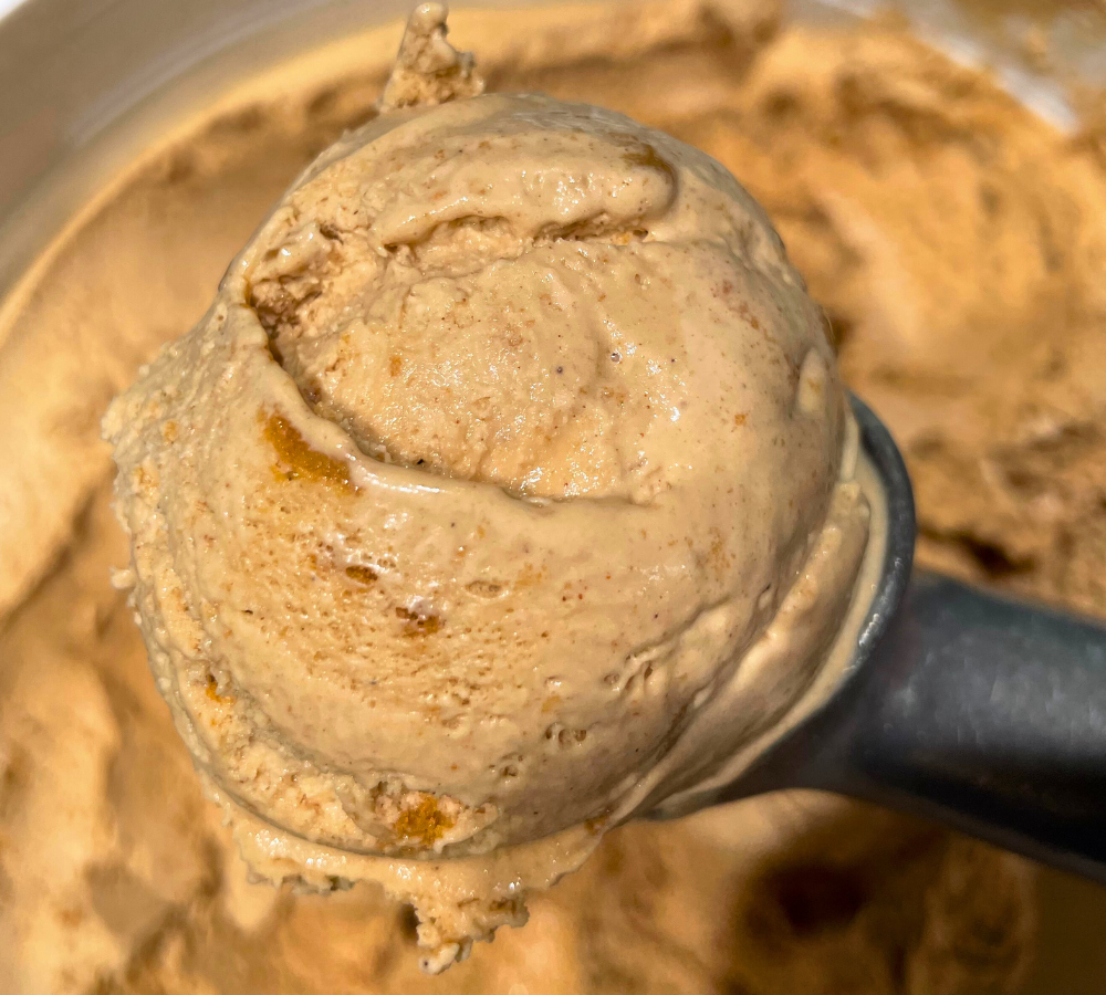 A close up of a scoop of ice cream on a table