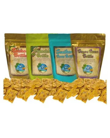 Three bags of crackers are sitting on top of each other on a table.