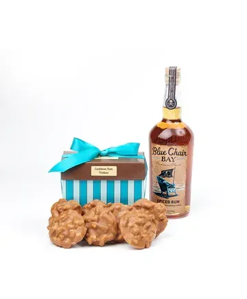 A bottle of blue collar bourbon next to a box of cookies.