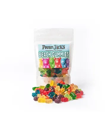 A bag of pecan jacks beach gummies is sitting on top of a pile of gummies.