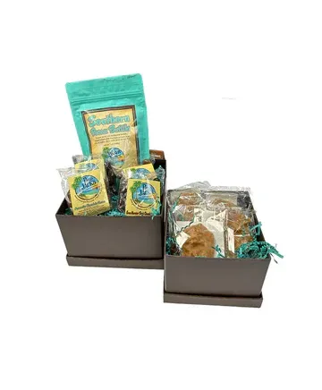 A couple of boxes filled with cookies and a bag of coffee.