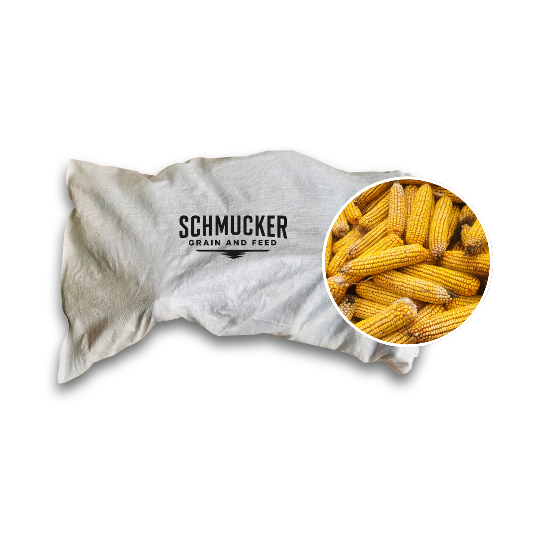 Bag of grain feed with corn, white bag, circled closeup of corn cobs.