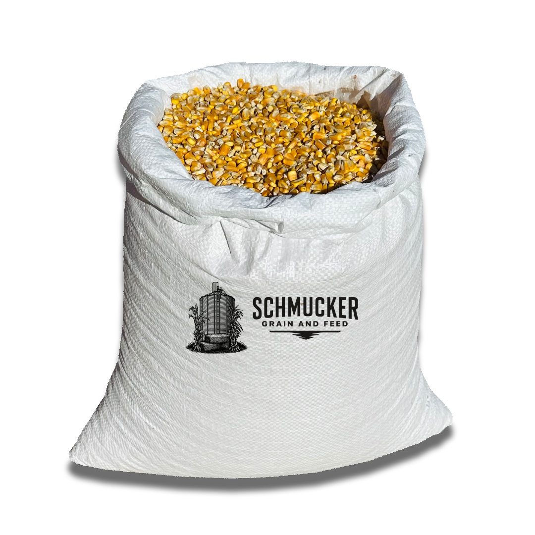 Bag of corn kernels, white bag, “Schmucker OF KIM AND FEED” logo.