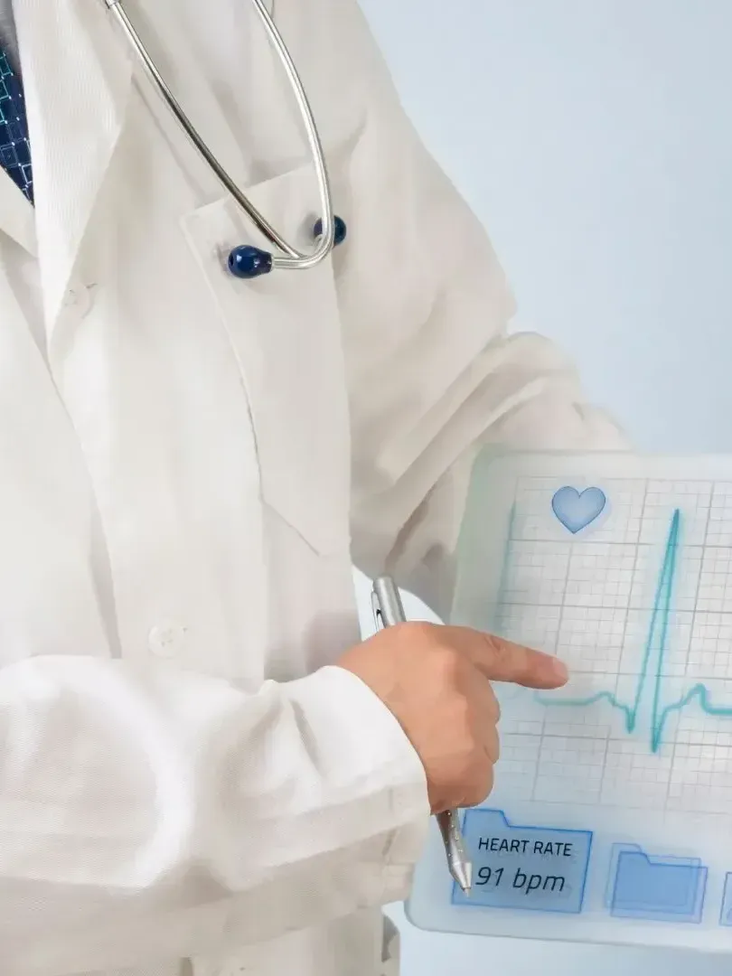 A doctor in a white coat is holding a heartbeat monitor