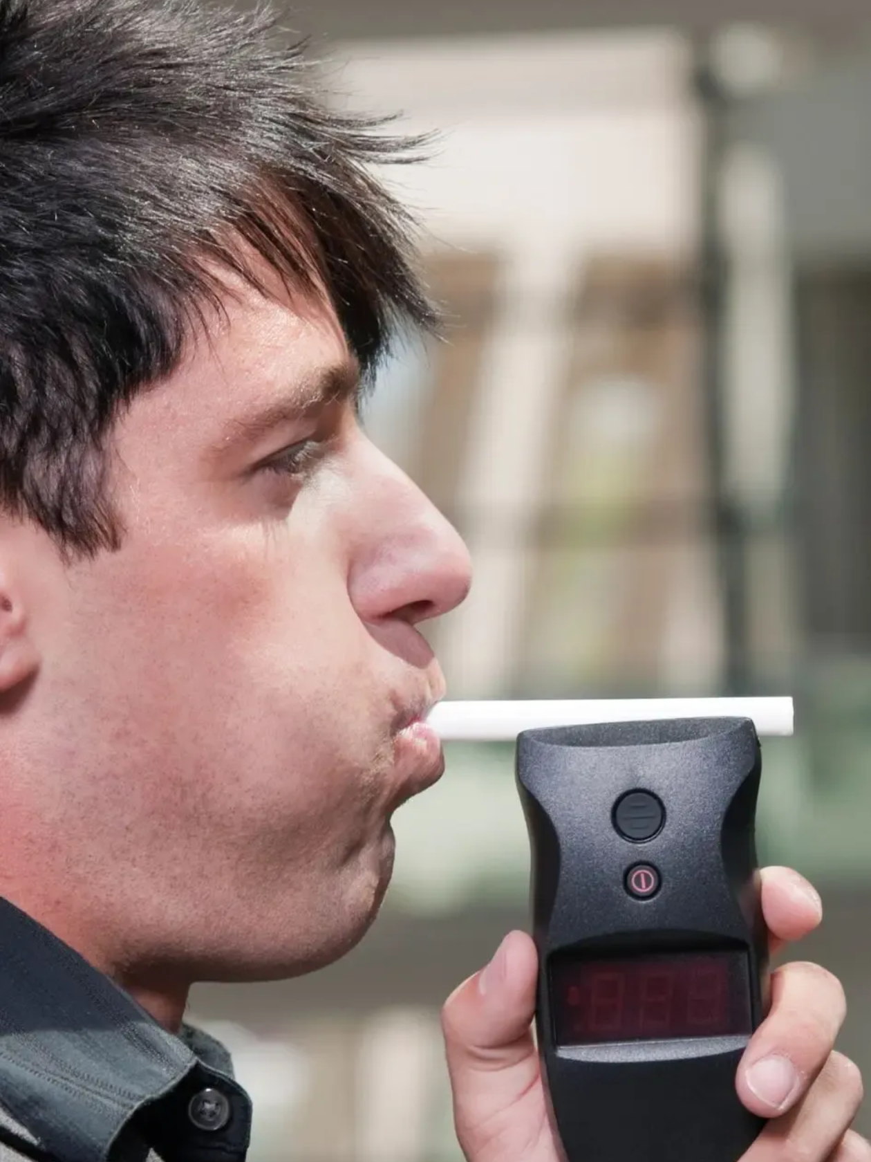 Doctor taking a patient's blood pressure with a stethoscope and cuff on their arm.