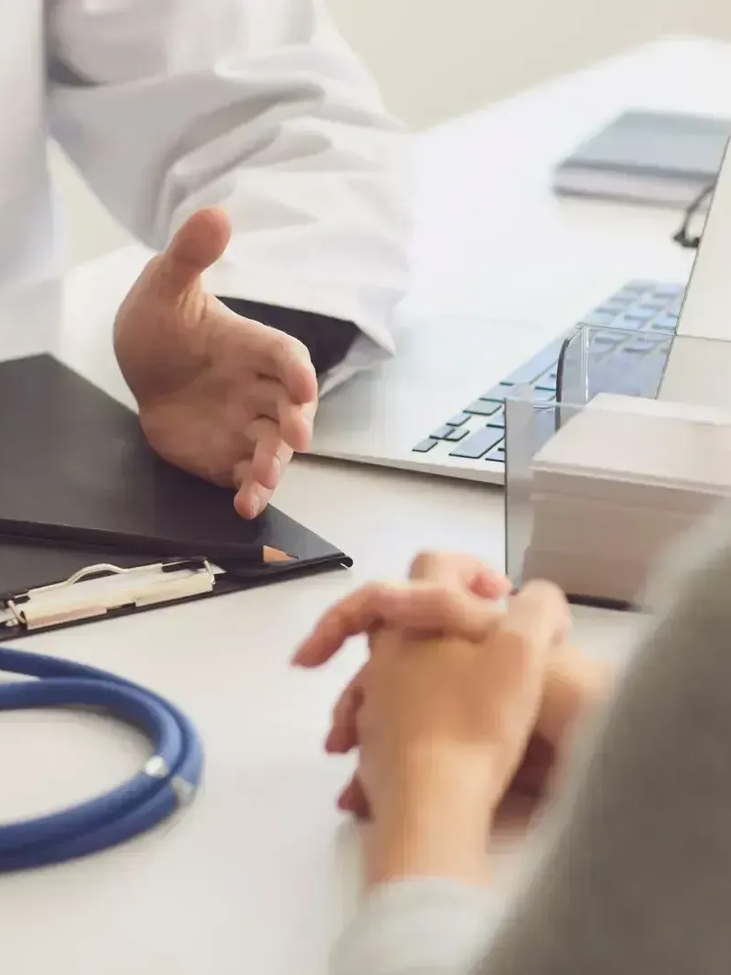 A close up of a woman 's ear with long hair.