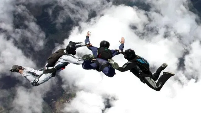 group of skydivers in freefall in  kansas city on a bright sunny day