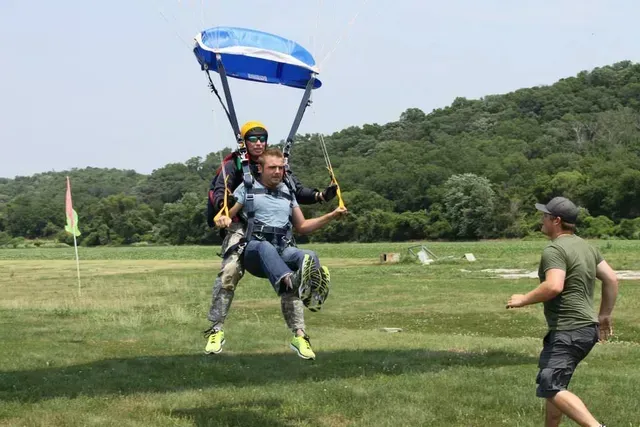 Tandem skydivers landing from the plane for a skydive near Kansas City