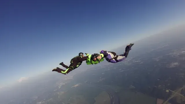 skydivers in freefall at kansas city dropzone during a beautiful summer day