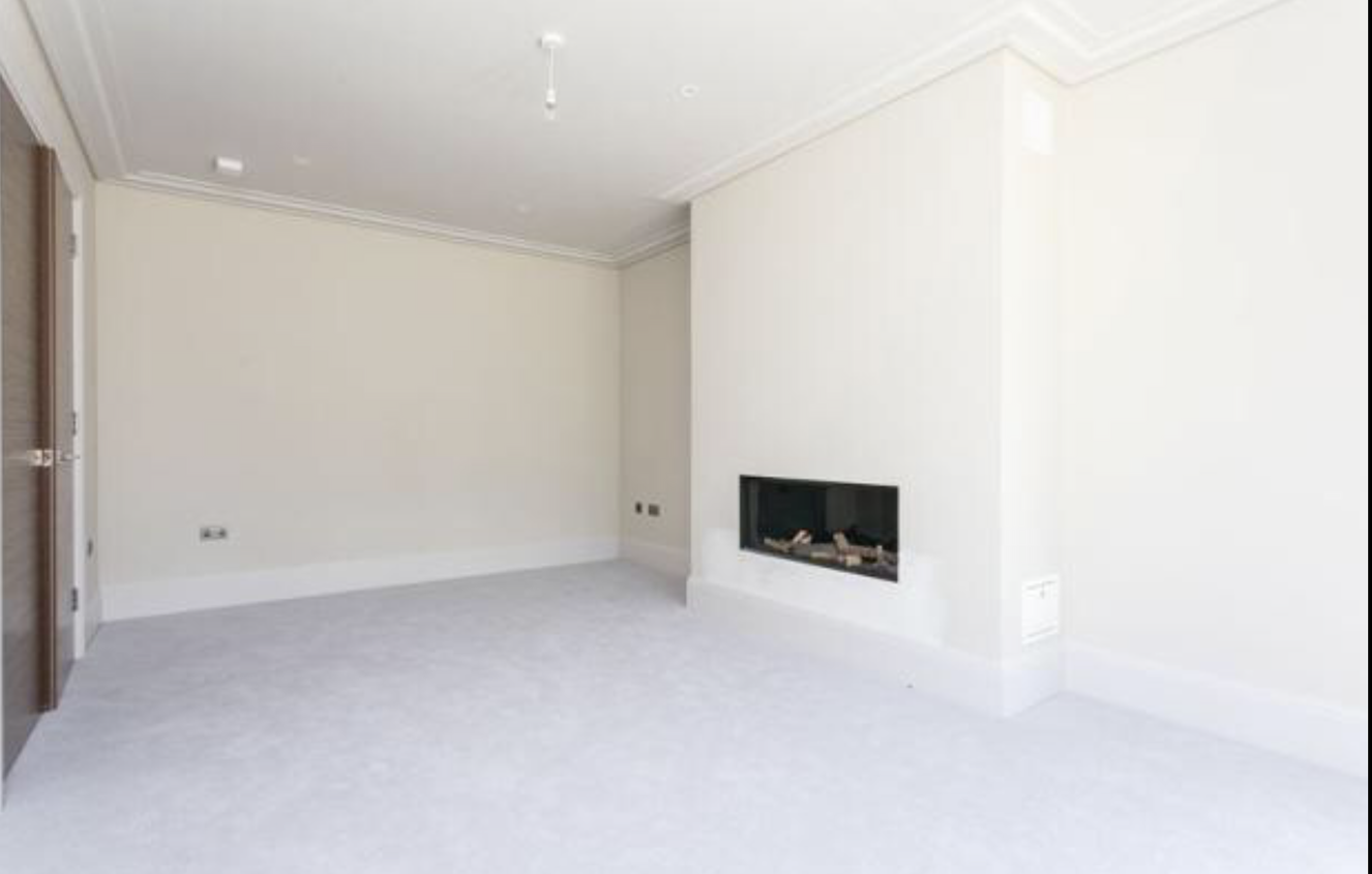 Freshly decorated bedroom with inset fireplace, white coving and fitted carpet, Birchwood Road SE London