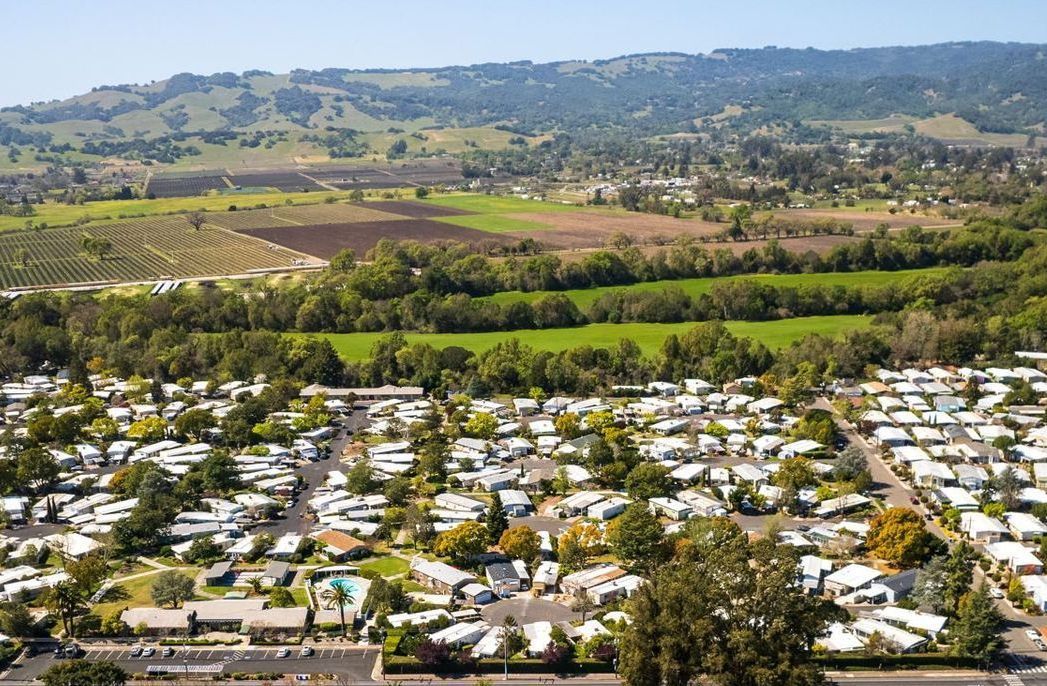 Aerial photo of Moon Valley Community with mountains in background.