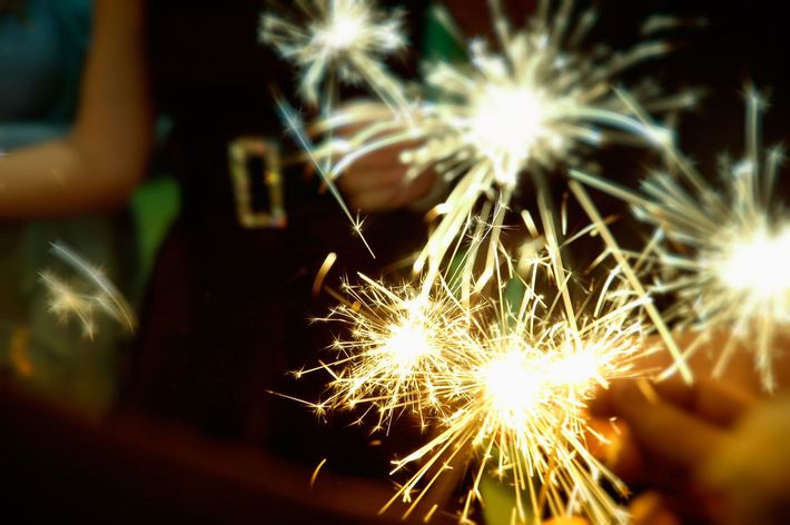 people holding sparklers