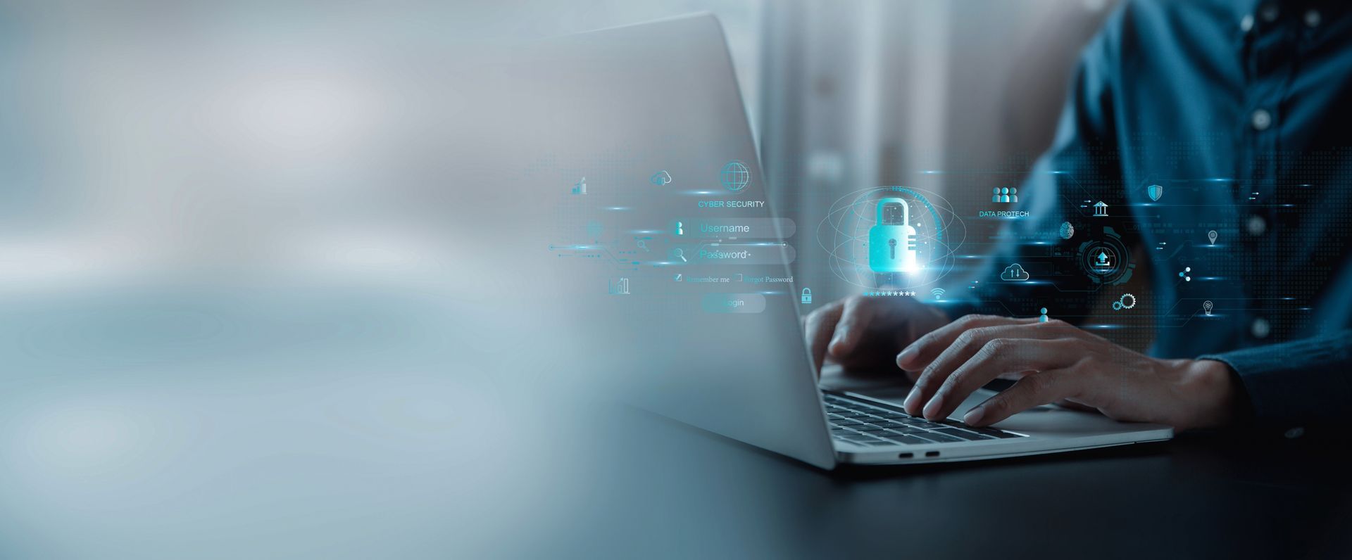 Cybersecurity: Person am Laptop mit digitalem Schloss