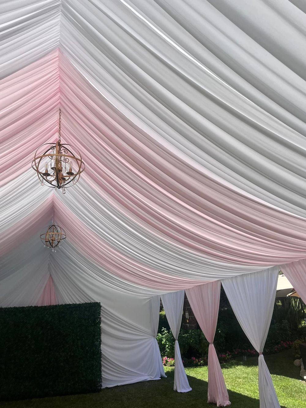 Pink and white draped tent