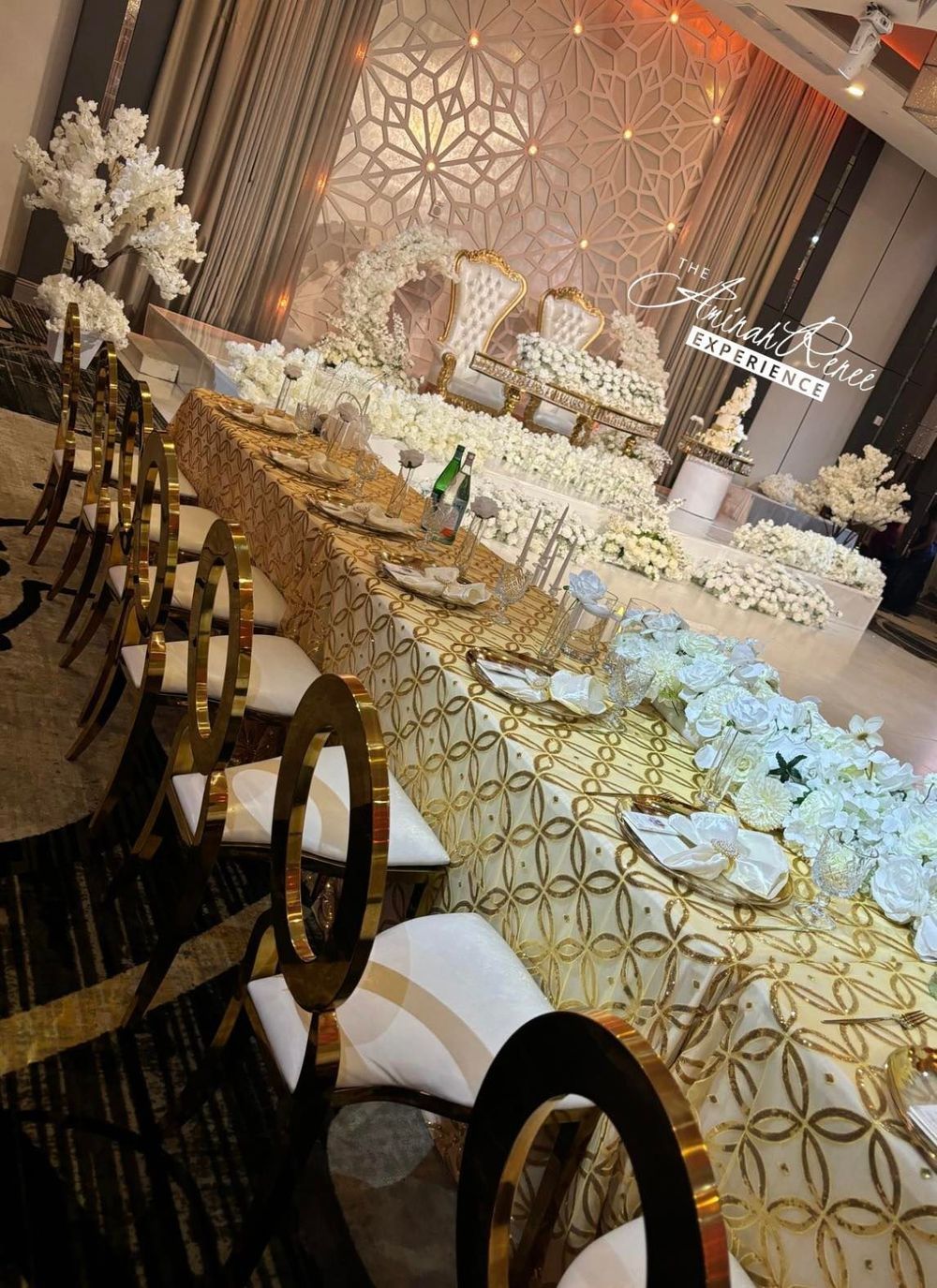 Elegant wedding reception with gold and white decor