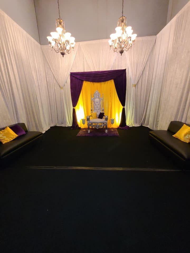 Throne room setup with gold and purple decorations