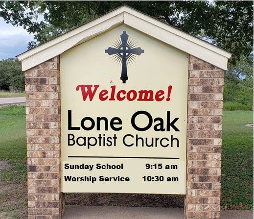 Sign for Lone Oak Baptist Church, with a cross, welcoming message, and service times.